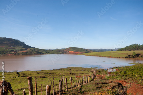 Canvas-taulu The natural scenery of Da Lat, sunlight shining through the thin mist at the foo