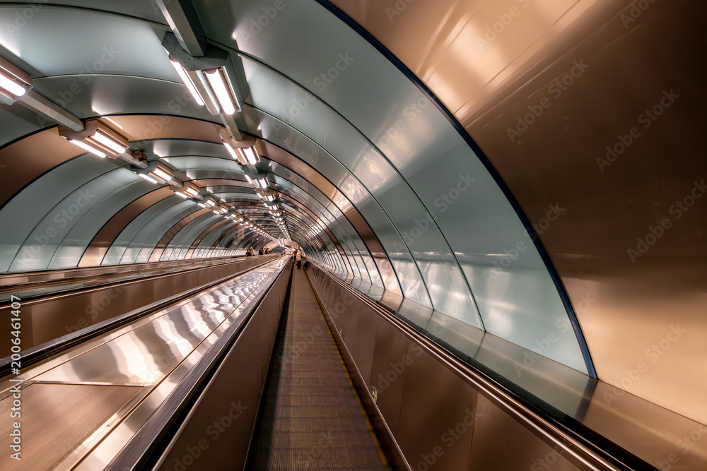 Fototapeta premium A long escalator in the St. Petersburg metro in Russia.
