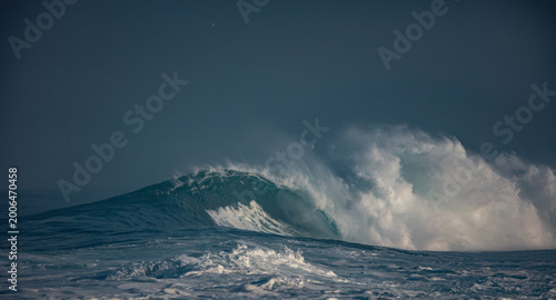 Huge waves crashing in ocean. Seascape environment background. Water texture with foam and splashes. Hawaiian surfing spots with nobody