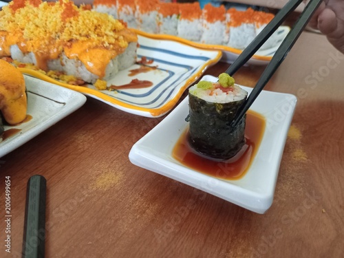 Sushi photo, Sushi is a typical Japanese dish that is famous throughout the world, made from rice seasoned with vinegar and combined with various fresh ingredients such as fish, seafood, vegetables an