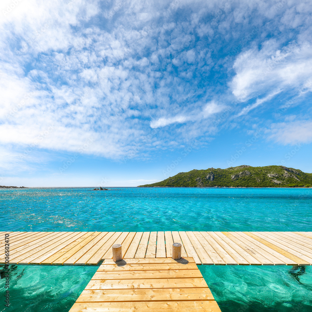 Fototapeta premium Breathtaking landscape with wooden pier on Santa Giulia beach.