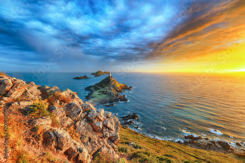 Amazing sunset over Torra di a Parata with Genoese Tower and Archipelago of Sanguinaires islands at background.
