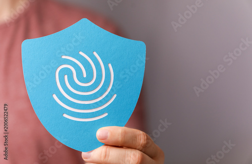 Canvastavla Person holding up a fingerprint protection icon showing cybersecurity and identi