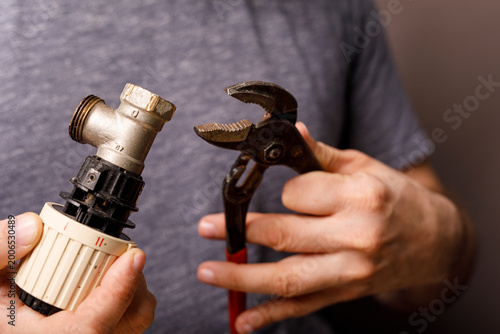 Close-up of a plumber's han...