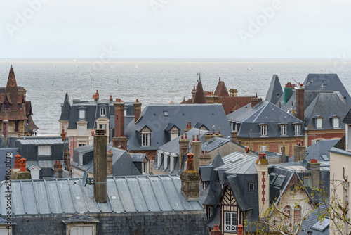 Tableau sur toile Rooftops of Trouville-sur-Mer with chimneys and slate tiles overlooking the calm