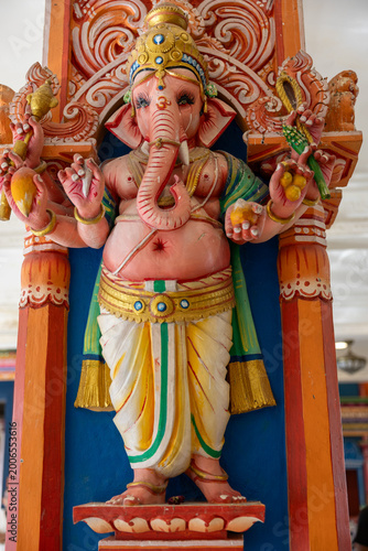 Photography Close-up of colorful Ganesha statue, the Hindu elephant-headed god, inside a temple in Kuala Lumpur, Malaysia