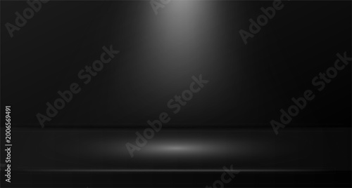 Foto Dramatic spotlight shining on empty dark stage with circular illuminated floor a