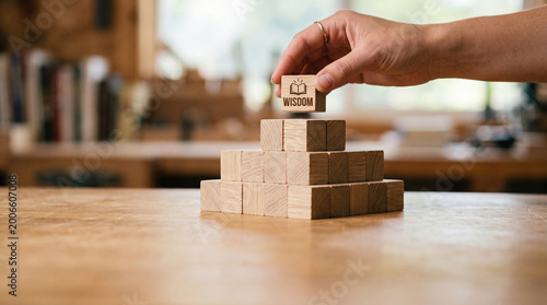 Ai federated learning network hand place wood block on stack in warm office concept of wisdom and strategy