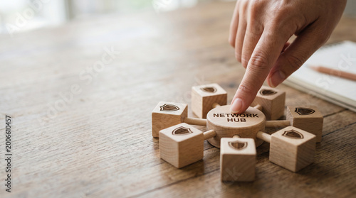 Network hub finger touching wooden network hub federated learning ai concept