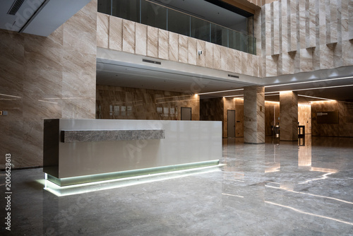 фотографія Modern marble office lobby with reception desk and spacious interior architectur