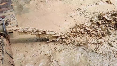 Mud Slurry Flow From Pipe Wet Soil Liquid Industrial Close Up