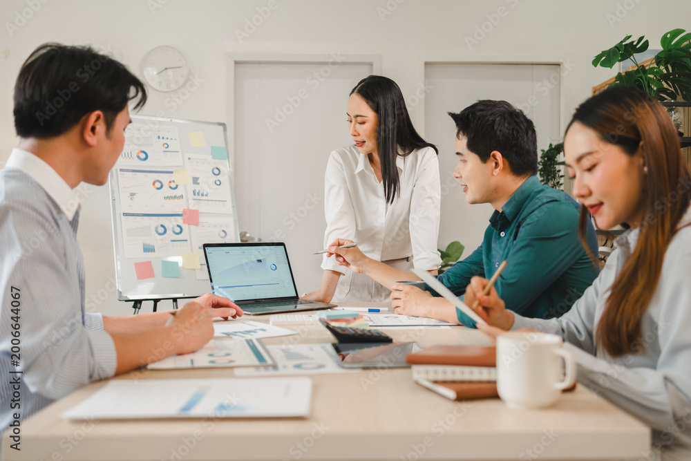 Fototapeta premium A team of diverse business professionals discussing data strategy during a collaborative office meeting