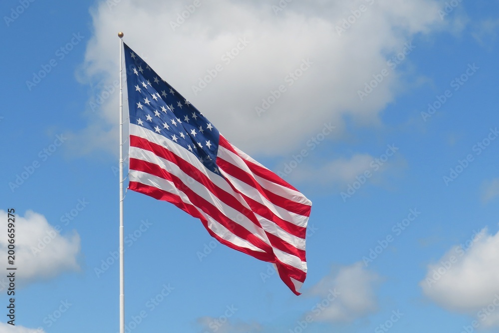 Obraz premium American flag against blue sky