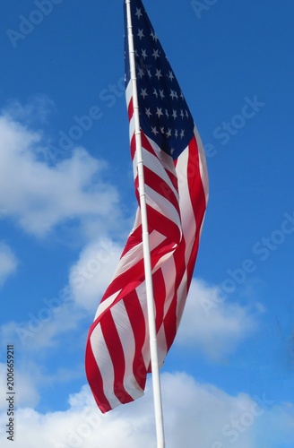 American flag on blue sky background