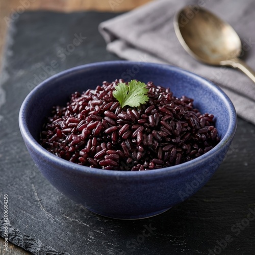 Bowl of black rice with cilantro garnish