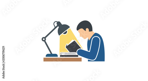 Tableau sur toile Man reading book under desk lamp.