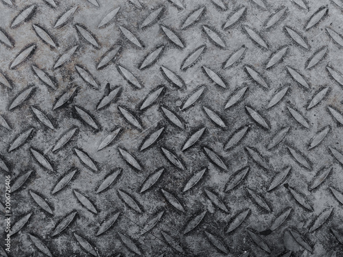 Close-up of worn metal diamond plate texture background