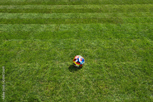Foto international game - ball on the green field in soccer stadium