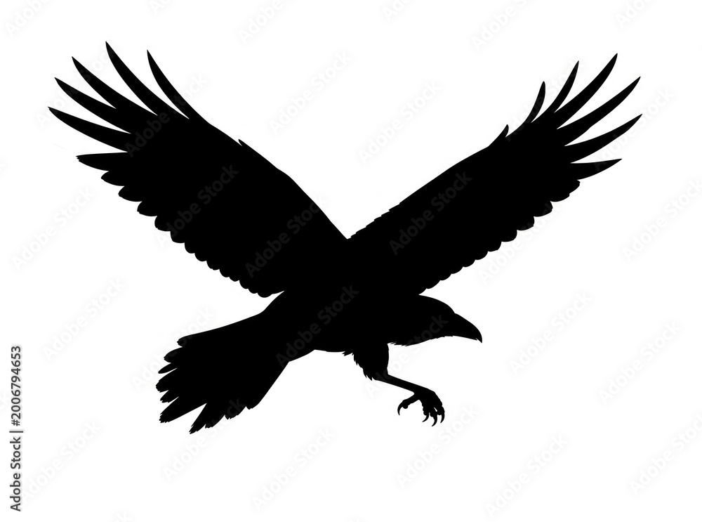 Fototapeta premium A black silhouette of a bird in mid-air against a bright blue or gray background