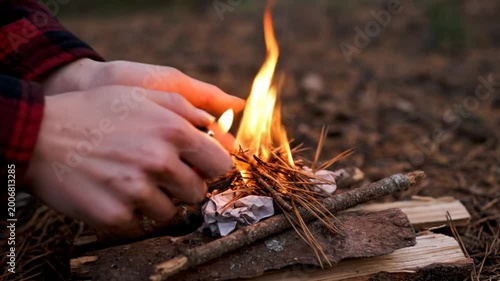 Igniting a Small Campfire Outdoors with Fire Starter and Kindling in a Forest Environment