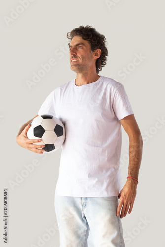 Man with a soccer ball and a white t-shirt with space to write
