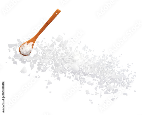Sea salt flakes with wooden spoon top view isolated on transparent background