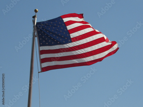 american flag against blue sky