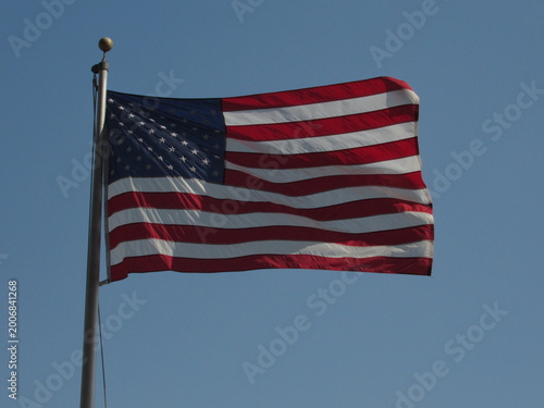 american flag against blue sky