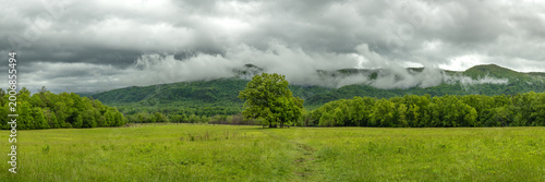 Rain Clouds Gather Over An Open Field In Cades Cove