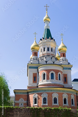 Russian Orthodox cathedral with golden domes under blue sky