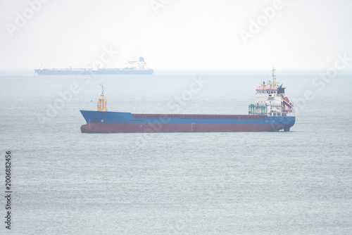 Vászonkép A tanker in an open roadstead at an anchorage in a sea bay.