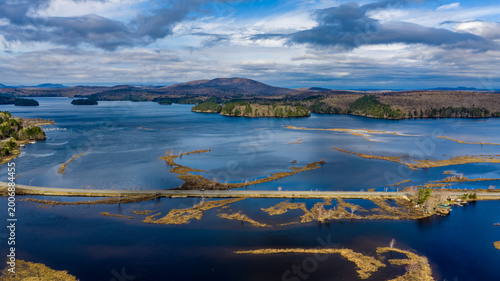 Фотография Tupper Lake, NY, USA - April 29, 2026  Aerial photo captures the Raquette river and surrounding wetlands of Tupper Lake in New York's Adirondack Mountains