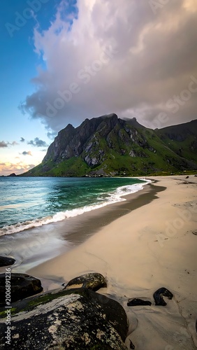 A serene beach with a mountainous backdrop