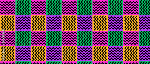 Traditional african kente inspired zigzag pattern with bold orange green and purple color blocks.