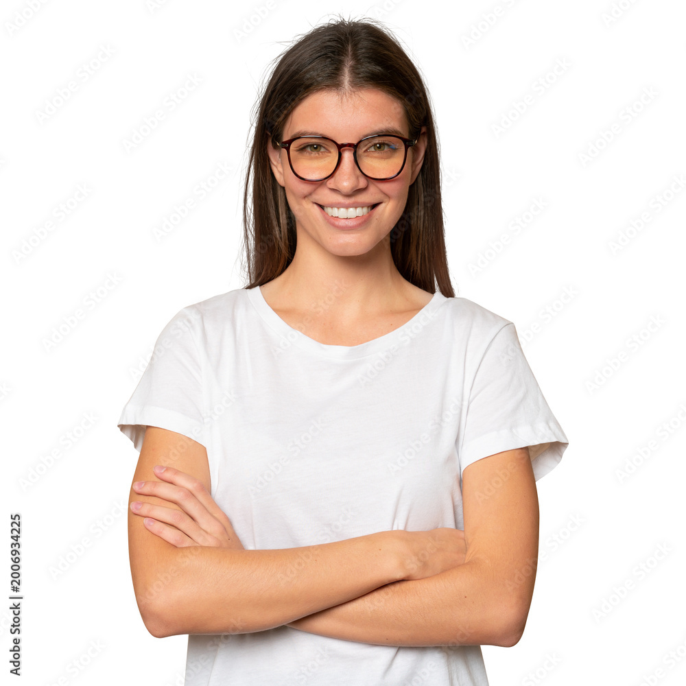 Fototapeta premium Portrait of confident student girl in white mockup t-shirt and glasses posing with crossed arms