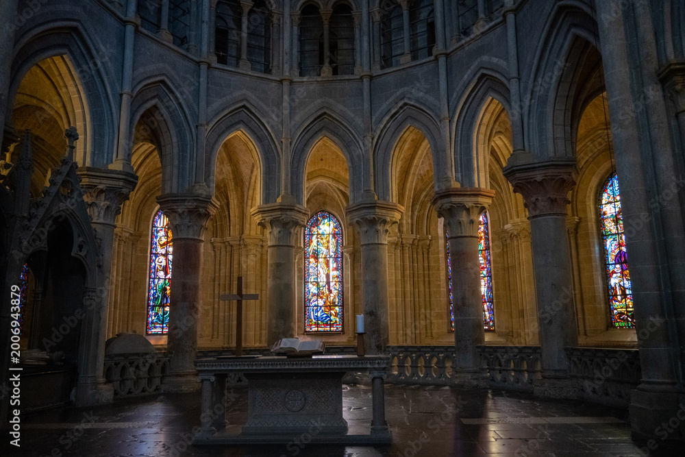 Fototapeta premium Altar and stained glass in cathedral sanctuary, Lausanne