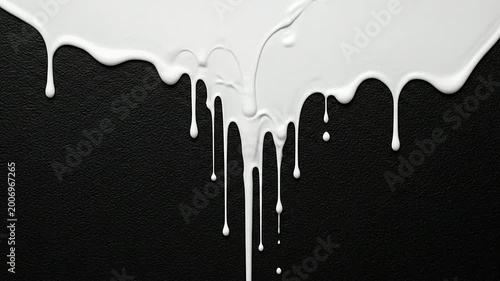 White liquid dripping down a textured dark surface