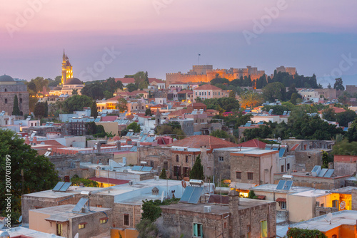 Old town skyline of Rhodes at sunset with medieval walls and historic buildings Greece