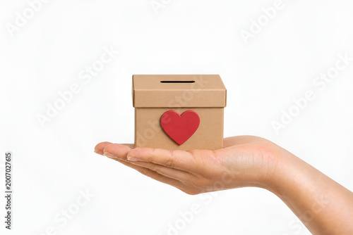 Female hand holding charity/donation box Charity, Giving, and Support Concept,Fundraising, Help and Kindness Concept,Generosity, Aid, and Social Support Theme