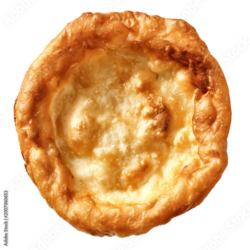 A close-up view of a savory pie on a white surface shows pastry and filling.