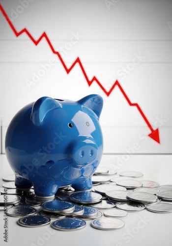 A blue ceramic piggy bank sits on a pile of scattered silver coins against a background featuring a red downward trend line on a graph, horizontal, blue, capital