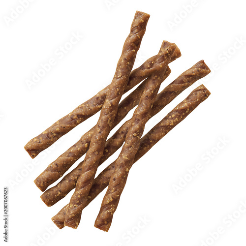 A pile of twisted brown dog chews on a white background