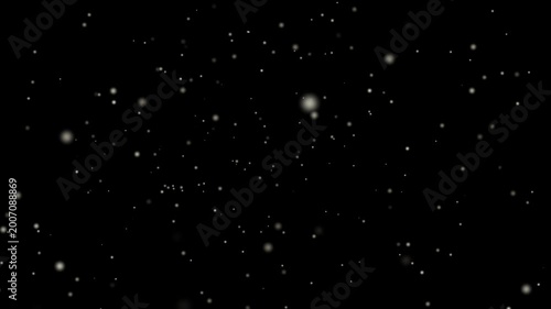An abstract motion of falling snowflakes and glowing dust particles drifting through a dark winter night sky across a black cosmic galaxy star field