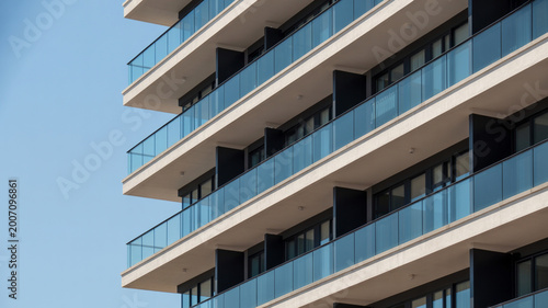 Modern apartment building with balconies and clean facade lines