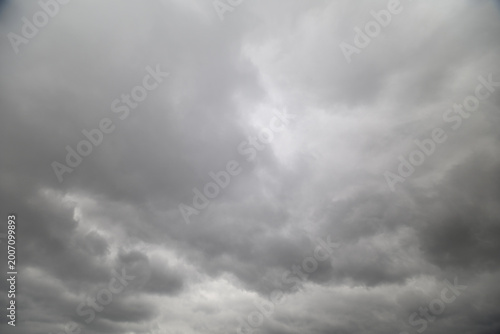 Bilde på lerret Brooding cloudy sky looming over coast, churning cloudbanks, winddriven texture,