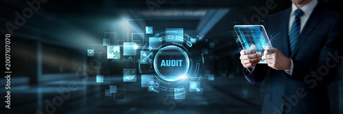Obraz na plátně Businessman working on digital screen with audit systems, data analytics and fin