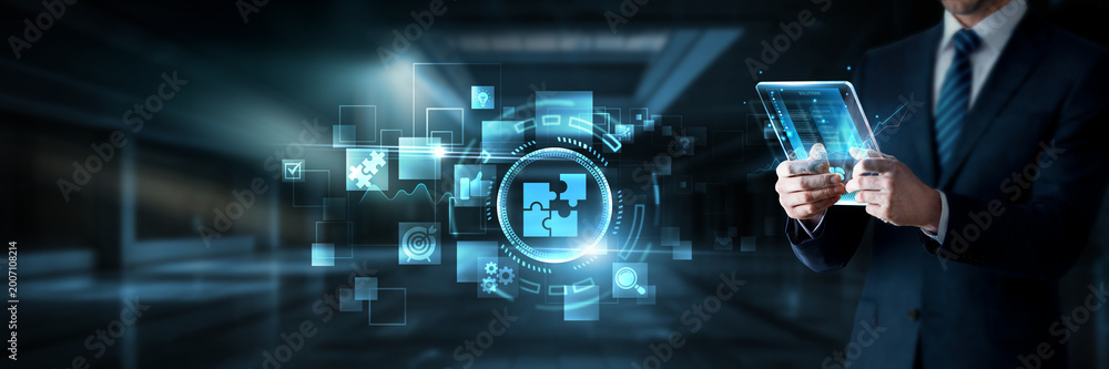 Obraz premium Businessman working on digital screen with business solutions, data analytics and problem solving systems, strategic planning, service optimization, digital transformation tools