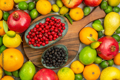 top view fresh fruits different ripe and mellow fruits on white desk photo tasty color diet berry health