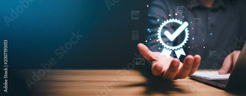 Man with glowing white quality assurance badge icon in hand, concept of high standards and verified services.