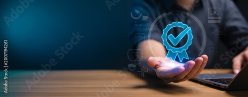 Man holding hand with glowing blue quality assurance badge icon, concept of certified and guaranteed services.